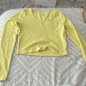 Yellow long sleeve crop top.